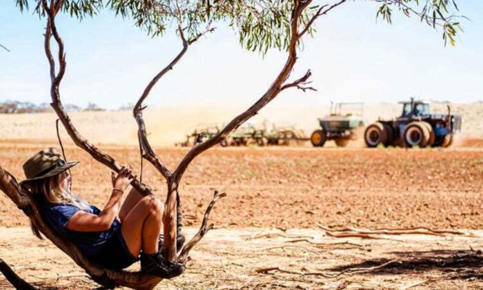 A supplied image obtained on Monday, June 20, 2022, of Poppy Thannhauser waits for her dad to finish work at a farm near Mildura, Victoria, in March 2022. The image was taken by her mother Aimee, as is one of 12 winners of Rural Aid's Spirit of the Bush photography awards. (AAP/Rural Aid/Aimee Thannhauser)
