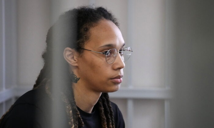 WNBA player and two-time Olympic gold medalist Brittney Griner sits in a cage at a court room prior to a hearing in Khimki just outside Moscow on July 27, 2022. (Alexander Zemlianichenko/AP Photo)