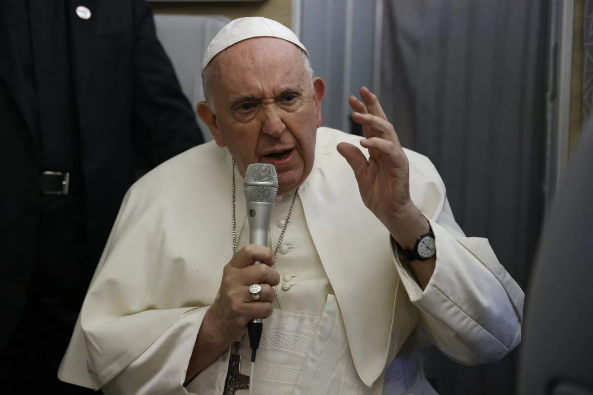Pope Francis speaks to journalists aboard the papal flight back from Canada on July 30, 2022, where he paid a six-day pastoral visit. (Guglielmo Mangiapane/Pool via AP)