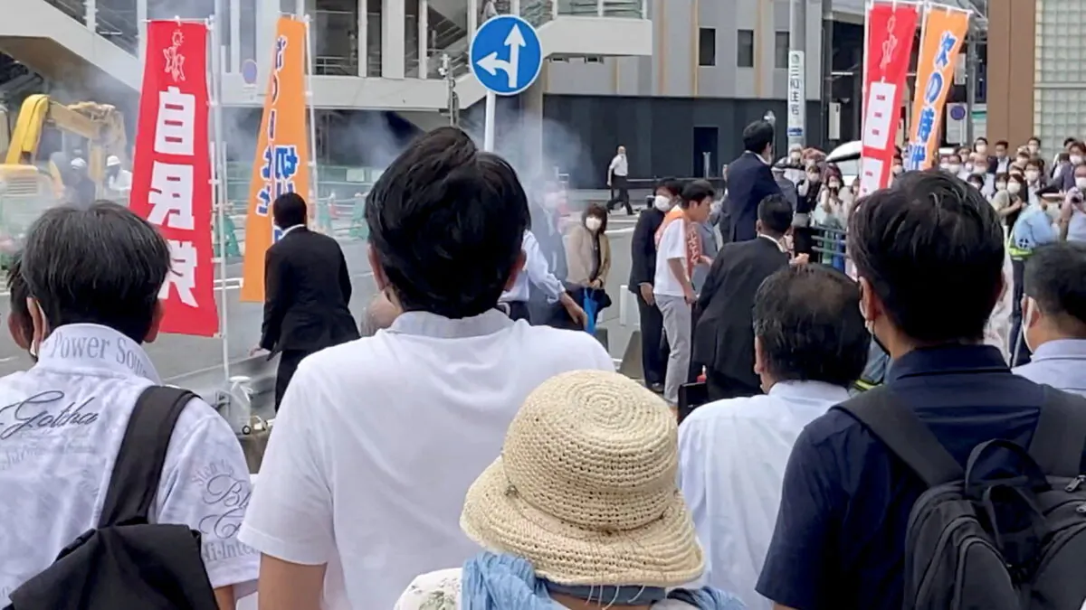 The first moment when a gunfire is shot while former Japanese prime minister Shinzo Abe speaks during an election campaign in Nara, Japan, on July 8, 2022, in this still image obtained from a social media video. (Takenobu Nakajima/via Reuters)