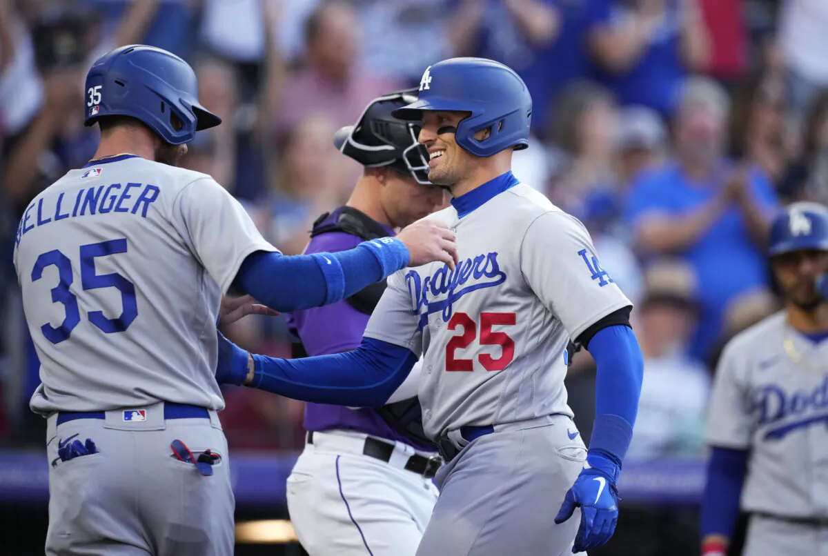 Los Angeles Dodgers' Cody Bellinger, left, congratulates Trayce Thompson, who hit a two-run home run off Colorado Rockies starting pitcher Chad Kuhl during the second inning of a baseball game in Denver, on July 29, 2022. (David Zalubowski/AP Photo)