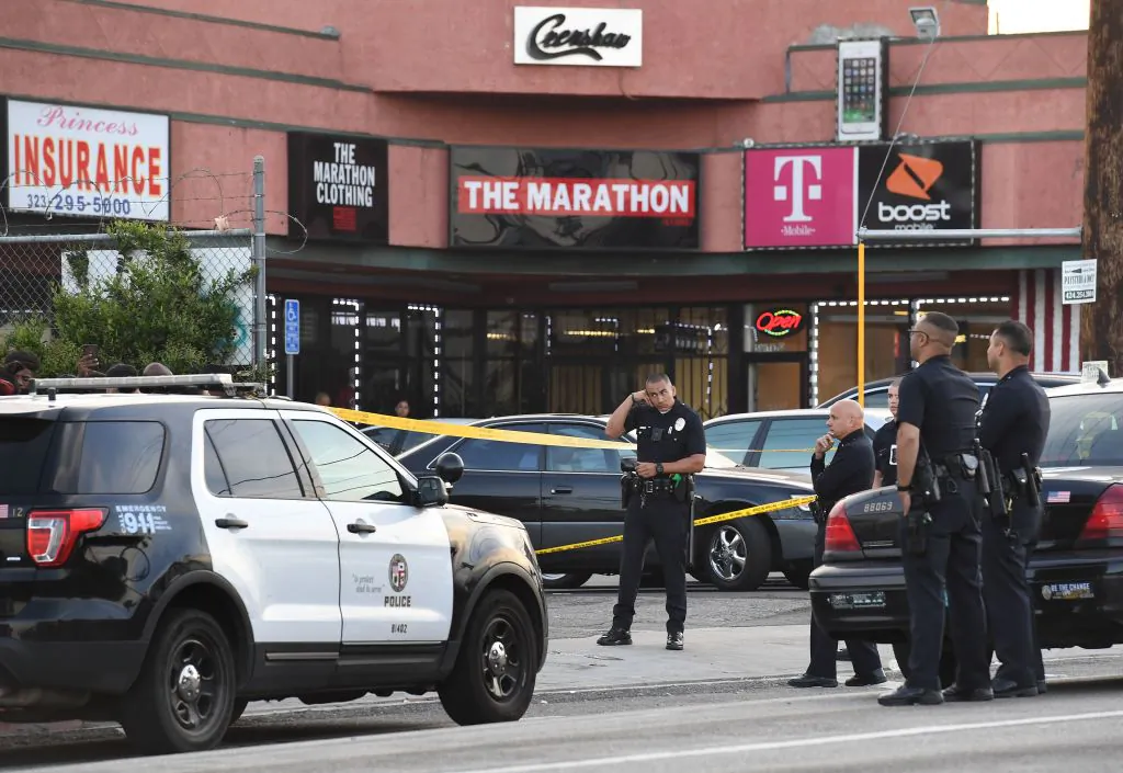 Police outside The Marathon clothing store owned by Grammy-nominated rapper Nipsey Hussle where he was fatally shot along with 2 other wounded, in Los Angeles on March 31, 2019. (Mark Ralston/AFP via Getty Images)