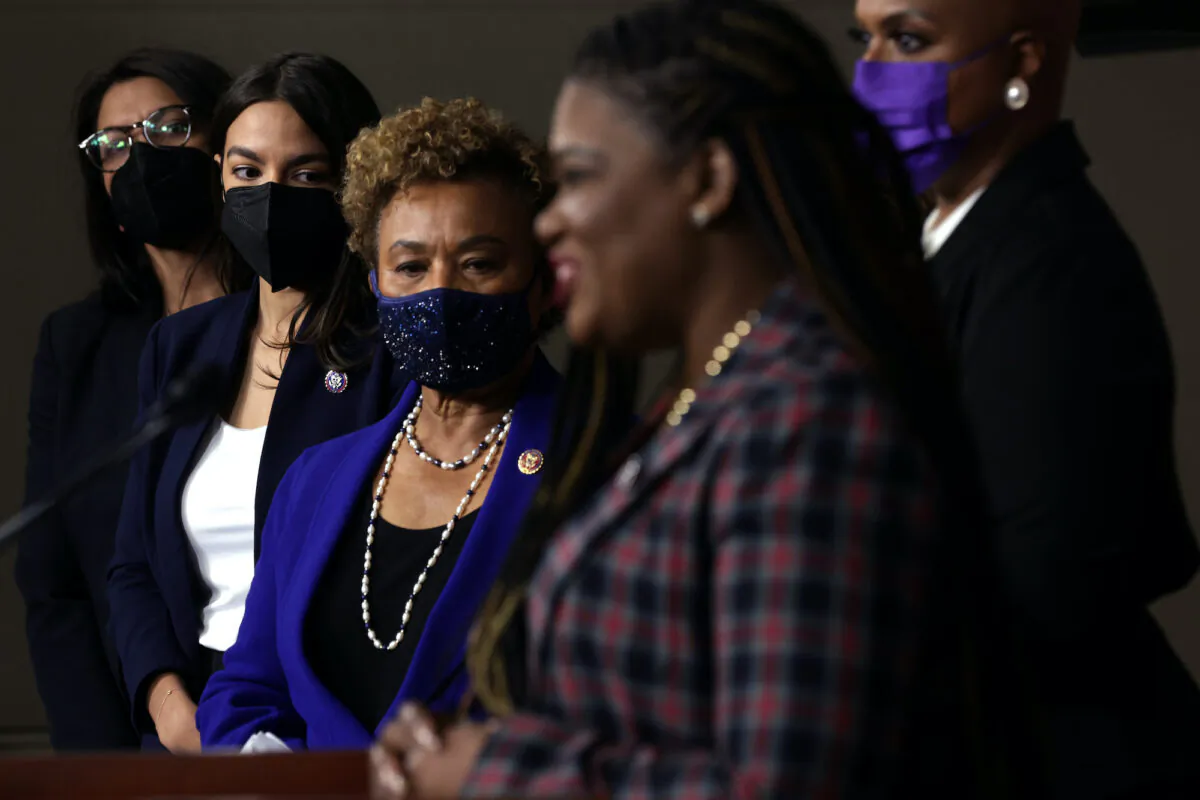 (L-R) Rep. Rashida Tlaib (D-Mich.), Rep. Alexandria Ocasio-Cortez (D-N.Y.), Rep. Barbara Lee (D-Calif.), Rep. Cori Bush (D-Mo.) and Rep. Ayanna Pressley (D-Mass.) participate in a news conference at the U.S. Capitol in Washington, D.C., on Dec. 8, 2021. (Alex Wong/Getty Images)