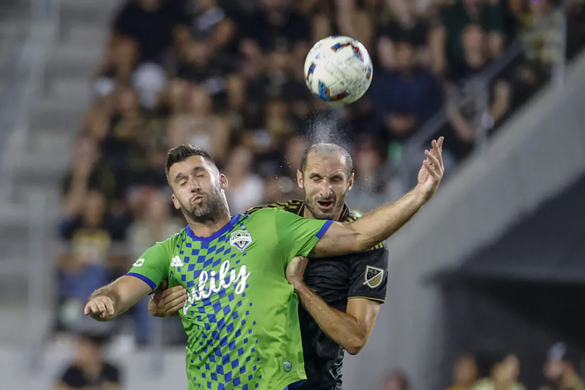 Los Angeles FC defender Giorgio Chiellini, right, and Seattle Sounders forward Will Bruin try to head the ball during the first half of an MLS soccer match in Los Angeles on July 29, 2022. (Ringo H.W. Chiu/AP Photo)