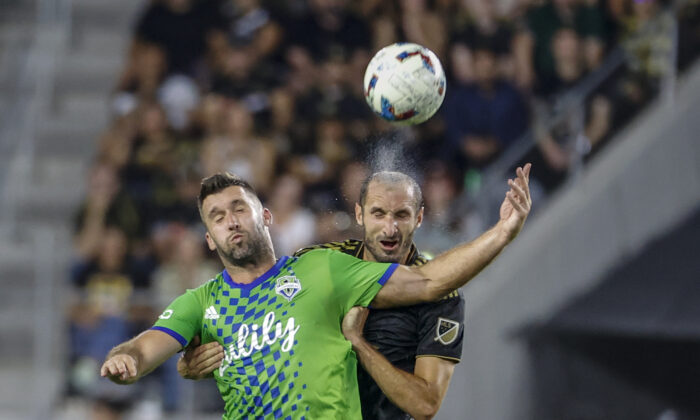 Los Angeles FC defender Giorgio Chiellini, right, and Seattle Sounders forward Will Bruin try to head the ball during the first half of an MLS soccer match in Los Angeles on July 29, 2022. (Ringo H.W. Chiu/AP Photo)