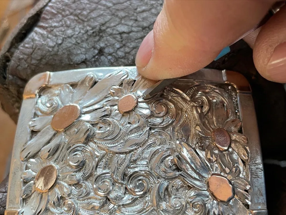 Silversmith Scott Hardy hand-sculpting a sterling silver buckle. (Leslie Hardy)