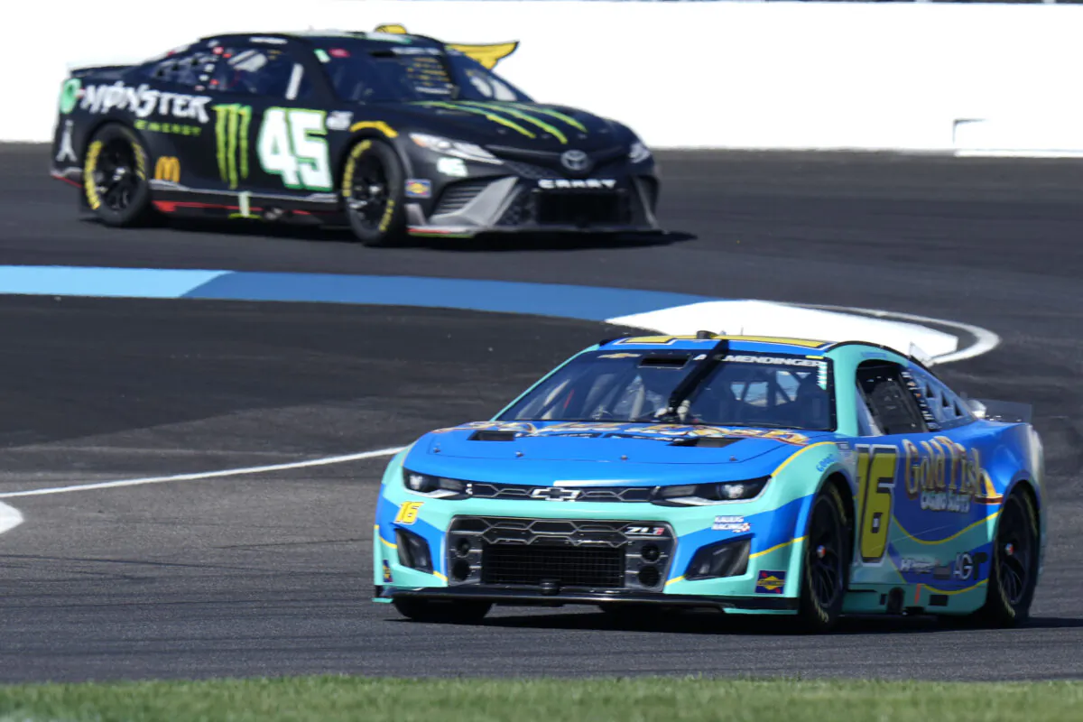 AJ Allmendinger (16) leads Ty Gibbs (45) through the first turn during practice for the NASCAR auto race at Indianapolis Motor Speedway in Indianapolis on July 30, 2022. (AJ Mast/AP Photo)