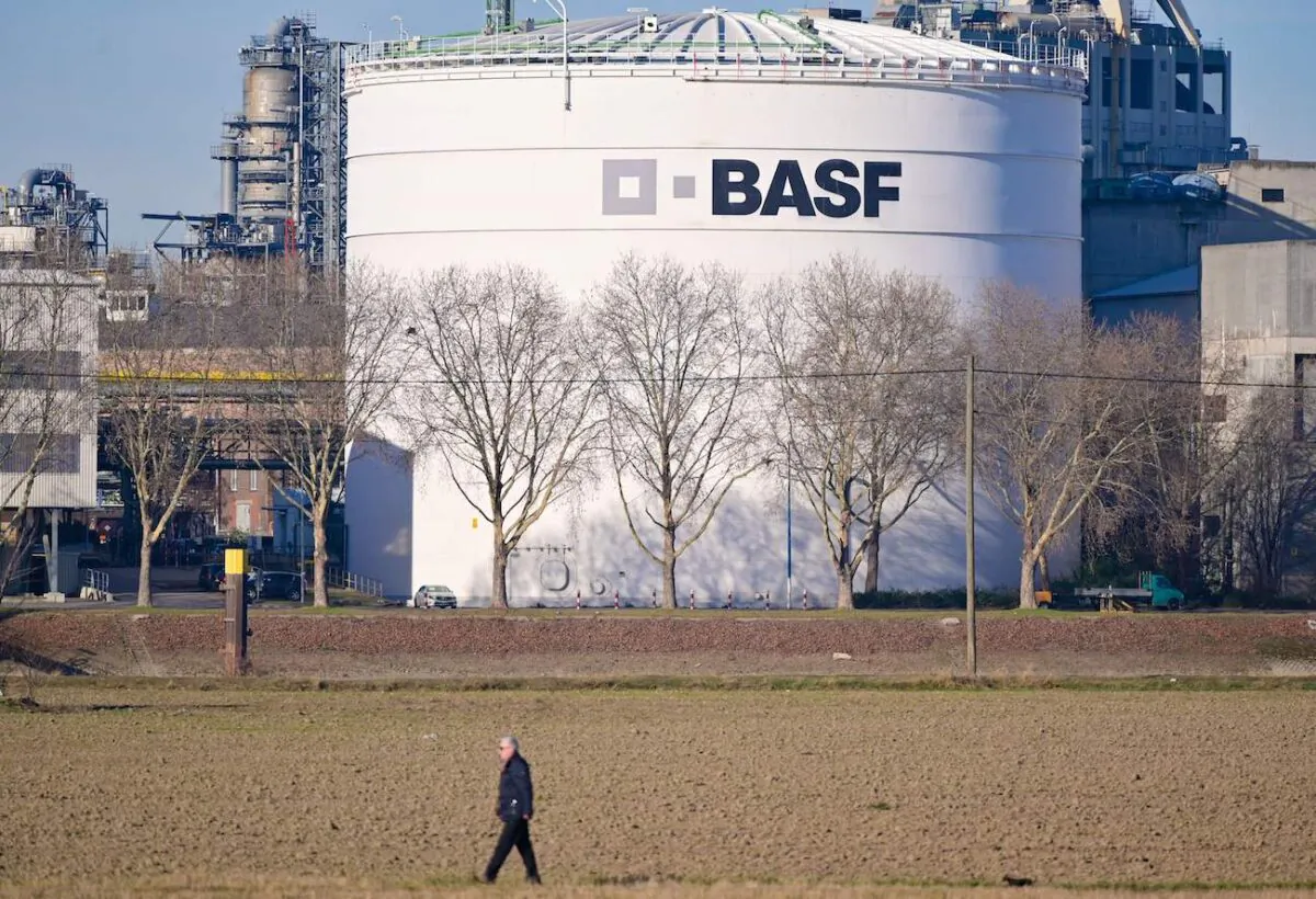 A man walks past tanks of German chemicals giant BASF at the company's headquarters in Ludwigshafen, Germany, on Feb. 26, 2019. (Uwe Anspach/DPA/AFP via Getty Images)