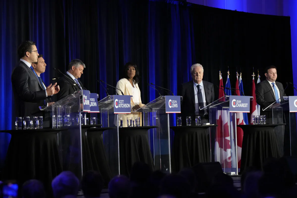 Conservative Party of Canada leadership candidates (L–R) Pierre Poilievre, Patrick Brown, Scott Aitchison, Leslyn Lewis, Jean Charest, and Roman Baber take part in the party's French-language leadership debate in Laval, Quebec, on May 25, 2022. (The Canadian Press/Ryan Remiorz)