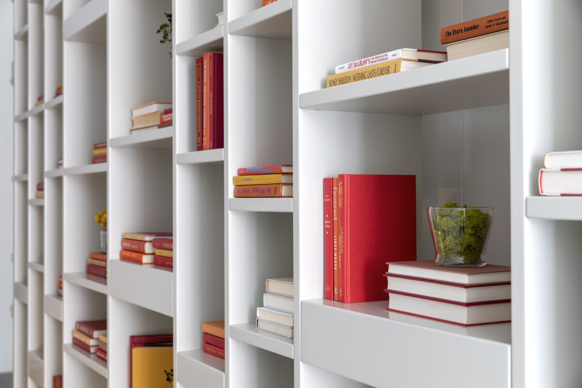 A bookcase is adorned with color-coordinated books. (Cathy Hobbs/TNS)