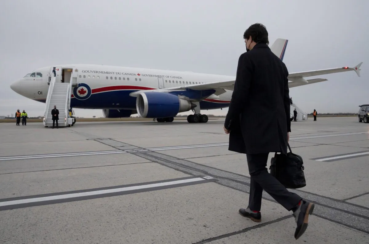 Prime Minister Justin Trudeau walks toward a government plane in Ottawa on Nov. 17, 2021. (The Canadian Press/Adrian Wyld)