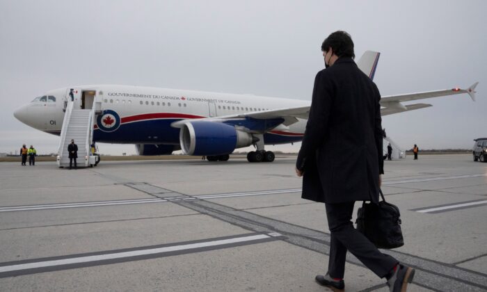 Prime Minister Justin Trudeau walks toward a government plane in Ottawa on Nov. 17, 2021. (The Canadian Press/Adrian Wyld)