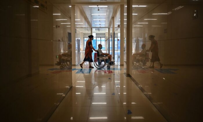 People wearing face masks in Tongji Hospital in Wuhan, Hubei Province, on September 3, 2020, during a media visit to the facility organized by local authorities. (Hector Retamal/AFP via Getty Images)