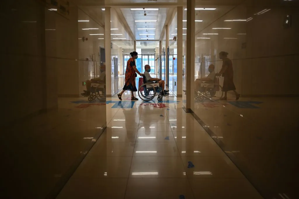 People wearing face masks in Tongji Hospital in Wuhan, Hubei Province, on September 3, 2020, during a media visit to the facility organized by local authorities. (Hector Retamal/AFP via Getty Images)