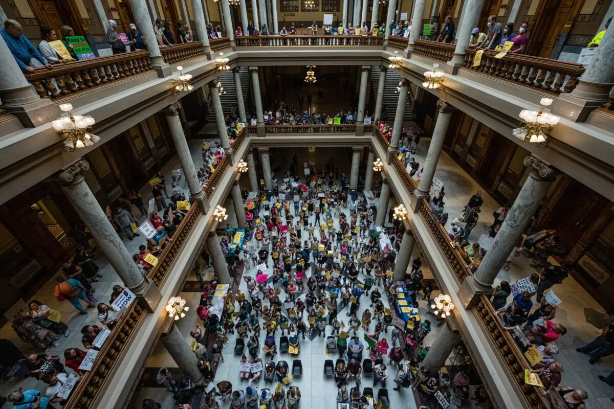 Pro-life and pro-abortion activists protest on multiple floors within the Indiana State Capitol rotunda in Indianapolis, Indiana, on July 25, 2022. Activists are gathering during a special session of the Indiana state Senate concerning abortion access in the state. (Jon Cherry/Getty Images)