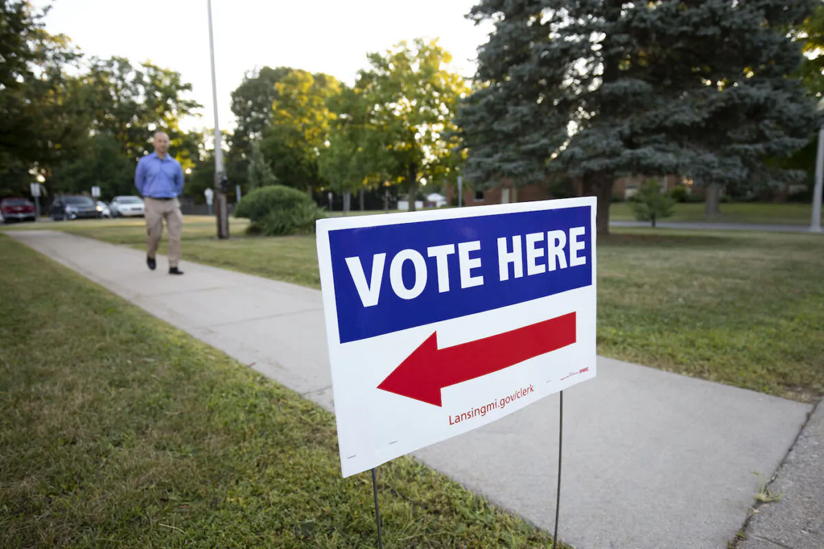 A voter arrives at a polling location to cast his ballot in the Michigan Primary Election in Lansing, Mich. on Aug. 2, 2022. (Bill Pugliano/Getty Images)