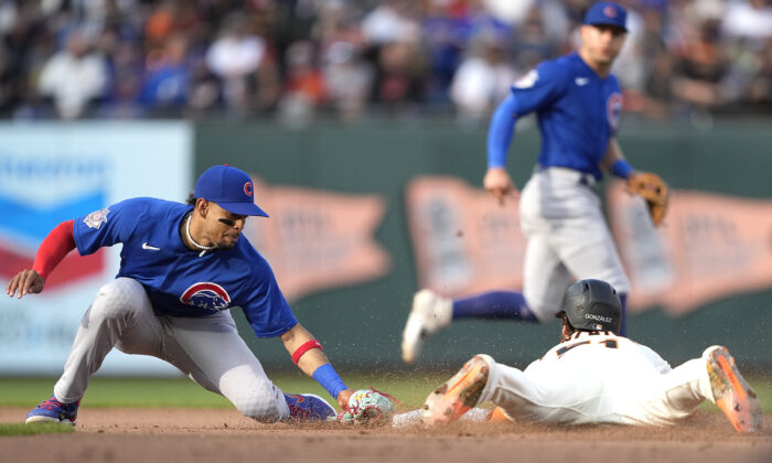 Luis Gonzalez #51 of the San Francisco Giants steals second base ahead of the tag from Christopher Morel #5 of the Chicago Cubs in the bottom of the seventh inning at Oracle Park in San Francisco, Calif., on July 31, 2022. (Thearon W. Henderson/Getty Images)