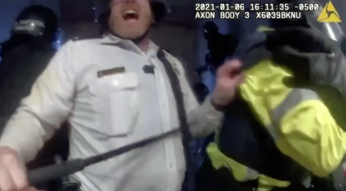 This image from video shows Metropolitan Police Commander Jason Bagshaw in the Lower West Terrace tunnel as Victoria White is led into the U.S. Capitol in Washington on Jan. 6, 2021. (Real Story of Jan. 6/Epoch TV)