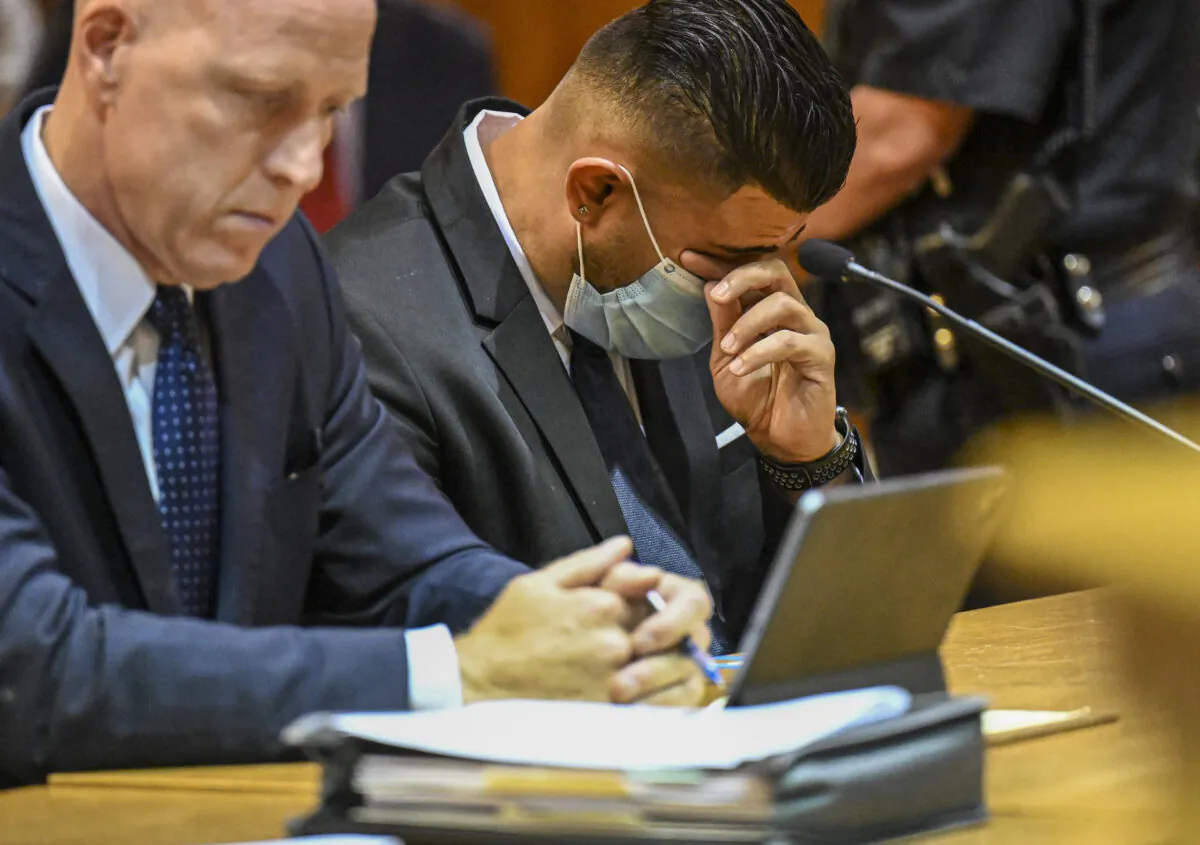 Lee Kindlon (L), attorney for Nauman Hussain, and Nauman Hussain, who ran the limo company involved in the 2018 limousine crash in Schoharie that killed 20 people, listens to a victim impact statement during a proceeding in Schoharie County court in Schoharie, N.Y., on Aug. 31, 2021. (Hans Pennink/AP Photo)