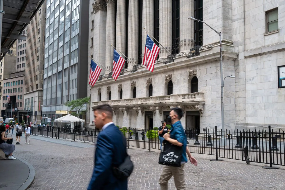People walk outside of the New York Stock Exchange (NYSE) in New York on July 25, 2022. (Spencer Platt/Getty Images)
