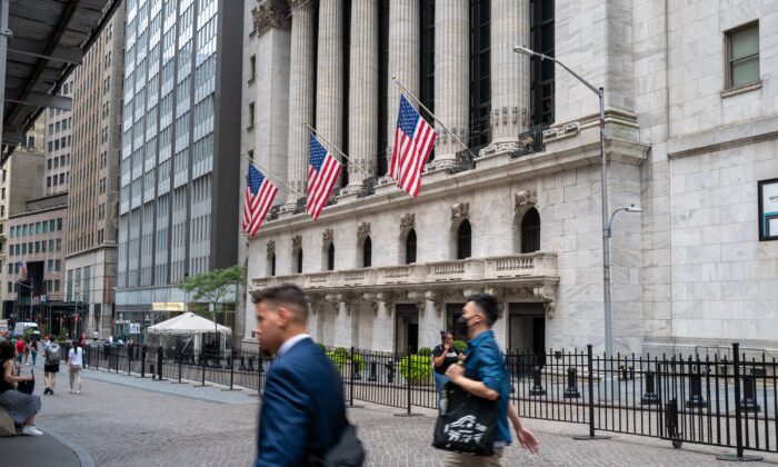 People walk outside of the New York Stock Exchange (NYSE) in New York on July 25, 2022. (Spencer Platt/Getty Images)