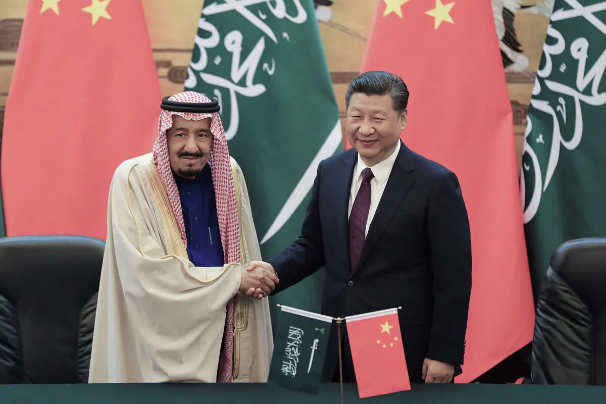 Chinese leader Xi Jinping shakes hands with Saudi Arabia's King Salman bin Abdulaziz Al Saud during a signing ceremony at the Great Hall of the People in Beijing on March 16, 2017. (Lintao Zhang/Pool/Getty Images)