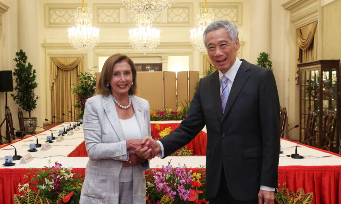 U.S. House Speaker Nancy Pelosi (L) shakes hands with Singapore's Prime Minister Lee Hsien Loong in Singapore on Aug. 1, 2022. (Mohd Fyrol Official Photographer/Ministry of Communications and Information/Handout via Reuters)