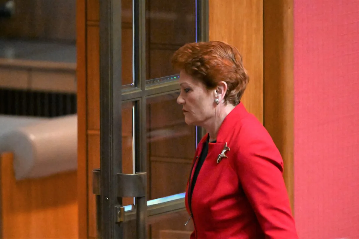 One Nation leader Pauline Hanson walks out after reacting to President Sue Lines's acknowledgement of country in the Senate chamber in Canberra, Australia, on July 27, 2022. (AAP Image/Mick Tsikas)
