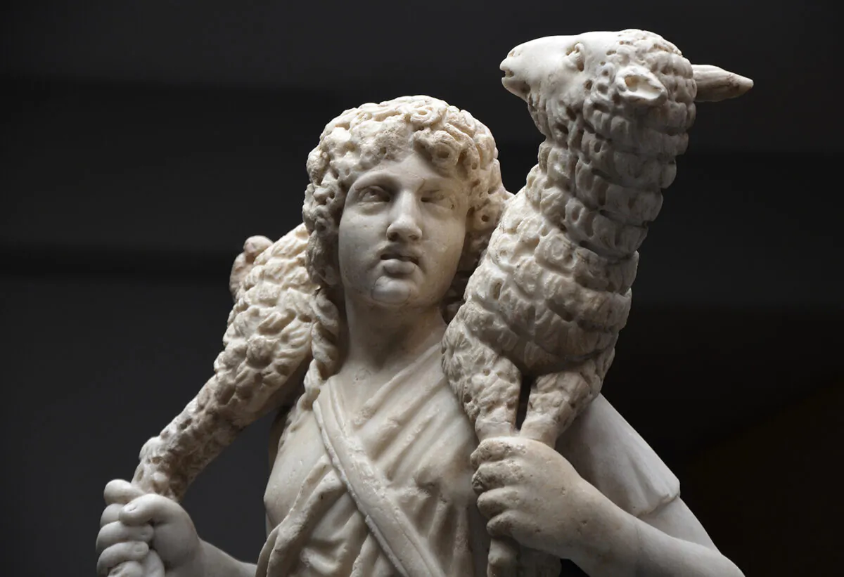 A detail of the marble statue, "The Good Shepherd," circa 300–350, by unknown artist, at the Catacombs of Domitilla, Vatican Museums. (Carole Raddato/CC BY-SA 2.0)