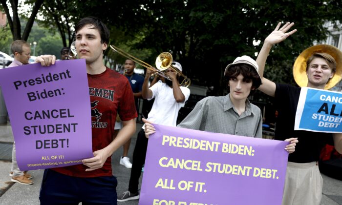 Activists rally outside the White House on July 27, 2022 to call on President Joe Biden to cancel student loan debt. It turns out student loans cost taxpayers much more than the Government Accountability Office estimated. (Anna Moneymaker/Getty Images)