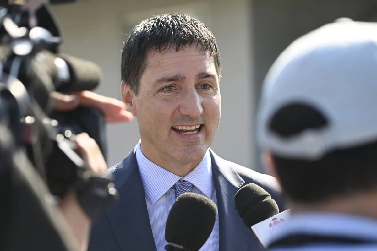 Prime Minister Justin Trudeau talks to media outside the Basilica of Sainte-Anne de Beaupré, east of Quebec City, during the papal visit of Pope Francis on July 28, 2022. (The Canadian Press/Bernard Brault)