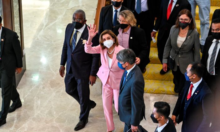 U.S. House Speaker Nancy Pelosi (C) waves to media as she tours the parliament house in Kuala Lumpur, Malaysia, on Aug. 2, 2022. (Malaysia’s Department of Information via AP)