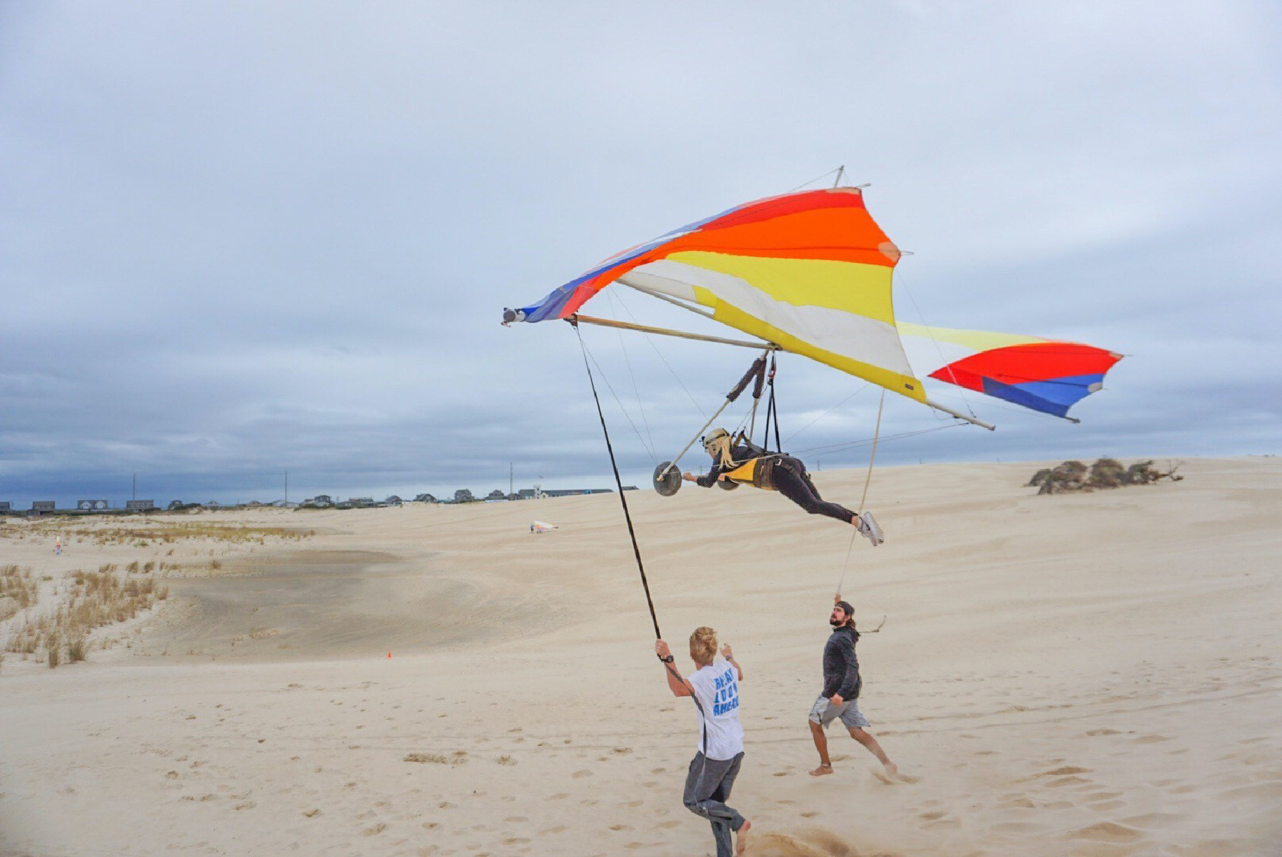 A couple learns to hang-glide in the Outer Banks of North Carolina. 