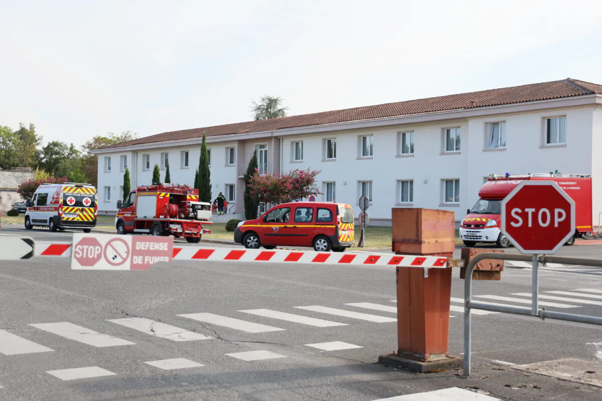 Firefighter vehicles at an entrance of the Manuco factory, which produces a compound used in gunpowder, after a blast occurred, injuring eight people, one of them seriously, in Bergerac, southern France, on Aug. 3, 2022. (Yohan Bonnet/AFP via Getty Images)