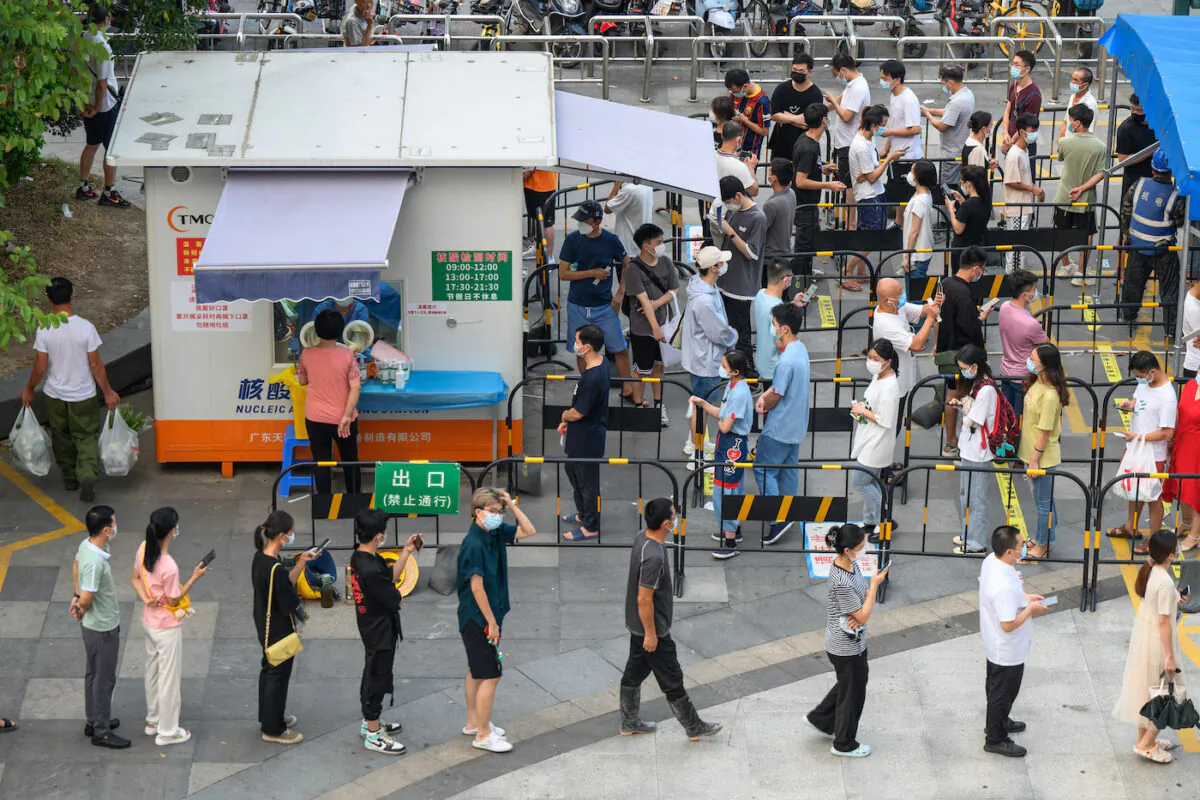 Residents queue to undergo PCR testing for COVID-19 at a swab collection site in Guangzhou, in China's southern Guangdong Province, in August of 2022. (STR/AFP via Getty Images)