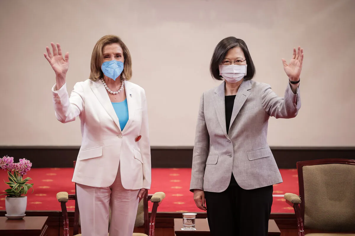 (L-R) House Speaker Nancy Pelosi (D-Calif.) poses for photographs with Taiwan's President Tsai Ing-wen at the president's office in Taipei, Taiwan, on Aug. 3, 2022. (Handout/Getty Images)