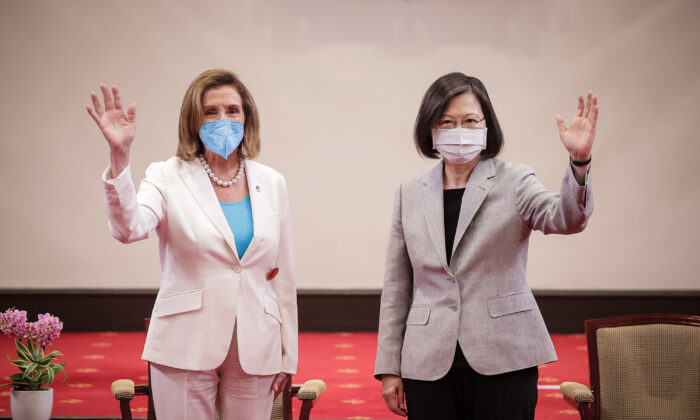 (L-R) House Speaker Nancy Pelosi (D-Calif.) poses for photographs with Taiwan's President Tsai Ing-wen, at the president's office in Taipei, Taiwan, on Aug. 3, 2022. (Handout/Getty Images)