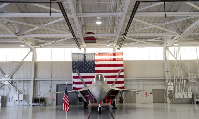A US Air Force Lockheed Martin F-22 Raptor stealth fighter aircraft is parked inside a hangar at Joint Base Langley-Eustis in Hampton, Virginia on Dec. 15, 2015. (Saul Loeb/AFP via Getty Images)