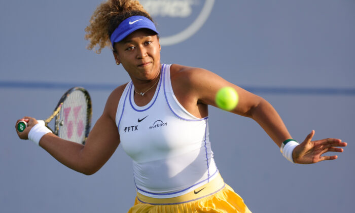 Naomi Osaka of Japan returns a shot from Qinwen Zheng of China during the Mubadala Silicon Valley Classic, part of the Hologic WTA Tour, at Spartan Tennis Complex in San Jose, Calif. on Aug. 2, 2022. (Carmen Mandato/Getty Images)