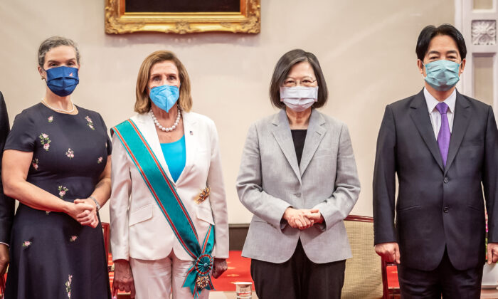 U.S. House Speaker Nancy Pelosi (D-Calif.) (center L), poses for photographs after receiving the Order of Propitious Clouds with Special Grand Cordon, Taiwan’s highest civilian honor, from Taiwan's President Tsai Ing-wen (center R) at the president's office in Taipei, Taiwan, on Aug. 3, 2022. (Chien Chih-Hung/Office of The President via Getty Images)