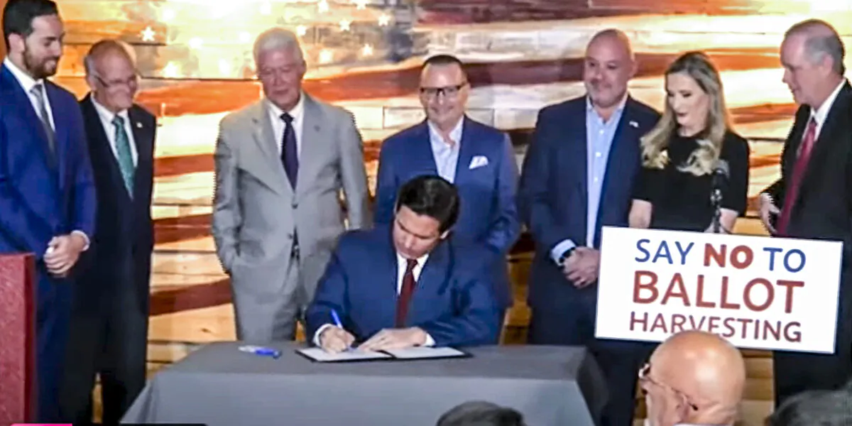 At an April 25, 2022 press conference in Spring Hill, Florida, Florida Governor Ron DeSantis signs bill into law that establishes the nation's first Office of Election Crimes and Security at the Department of State specifically to investigate voter fraud. (Patricia Tolson/The Epoch Times)
