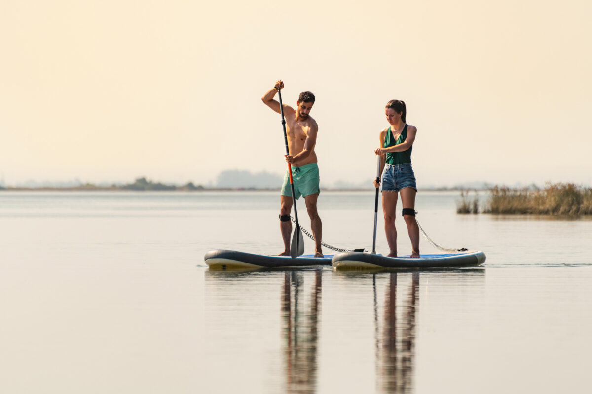 Families can enjoy stand-up paddleboarding at many resorts and scenic recreation areas. (Dreamstime/TNS)