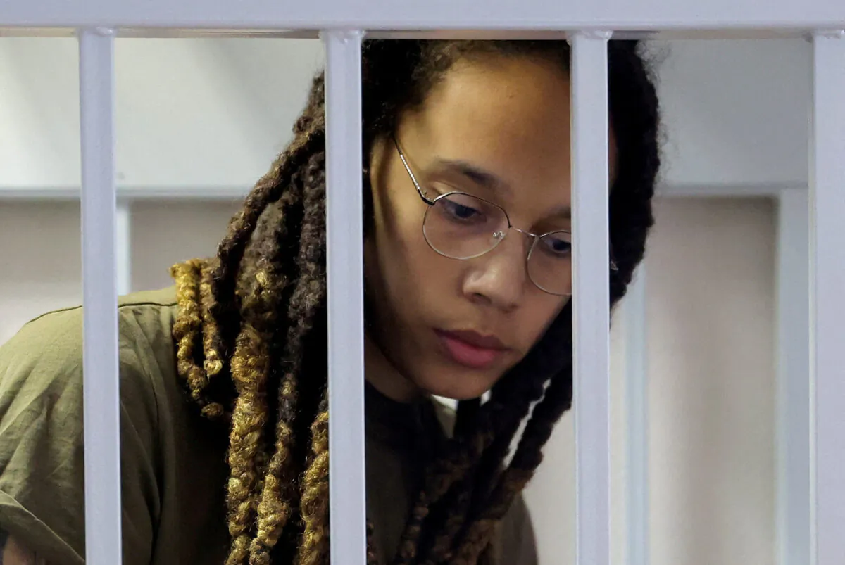 U.S. basketball player Brittney Griner, who was detained at Moscow's Sheremetyevo airport and later charged with illegal possession of cannabis, looks on inside a defendants' cage before a court hearing in Khimki outside Moscow, Russia, on Aug. 2, 2022. (Evgenia Novozhenina/Pool via Reuters)