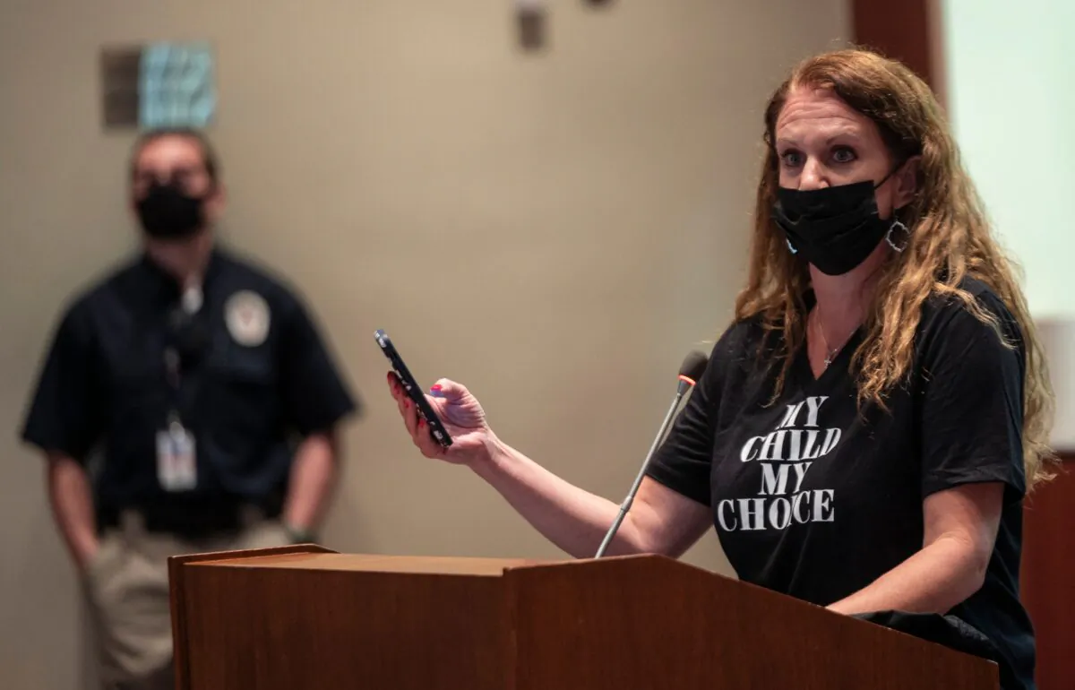 Patti Hidalgo Menders speaks out against board actions during a Loudoun County Public Schools (LCPS) board meeting in Ashburn, Virginia on Oct. 12, 2021. Loudoun county school board meetings had become tense with parents clashing with board members over transgender issues, the teaching of Critical Race Theory (CRT) and Covid-19 mandates. (Andrew Caballero-Reynolds/AFP via Getty Images)