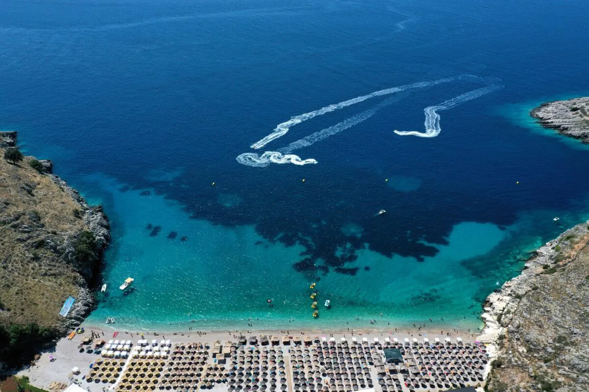People take part in water sports next to the beach of Llaman, near the city of Himare in southern Albania, on Aug. 6, 2019. (Gent Shkullaku/AFP via Getty Images)