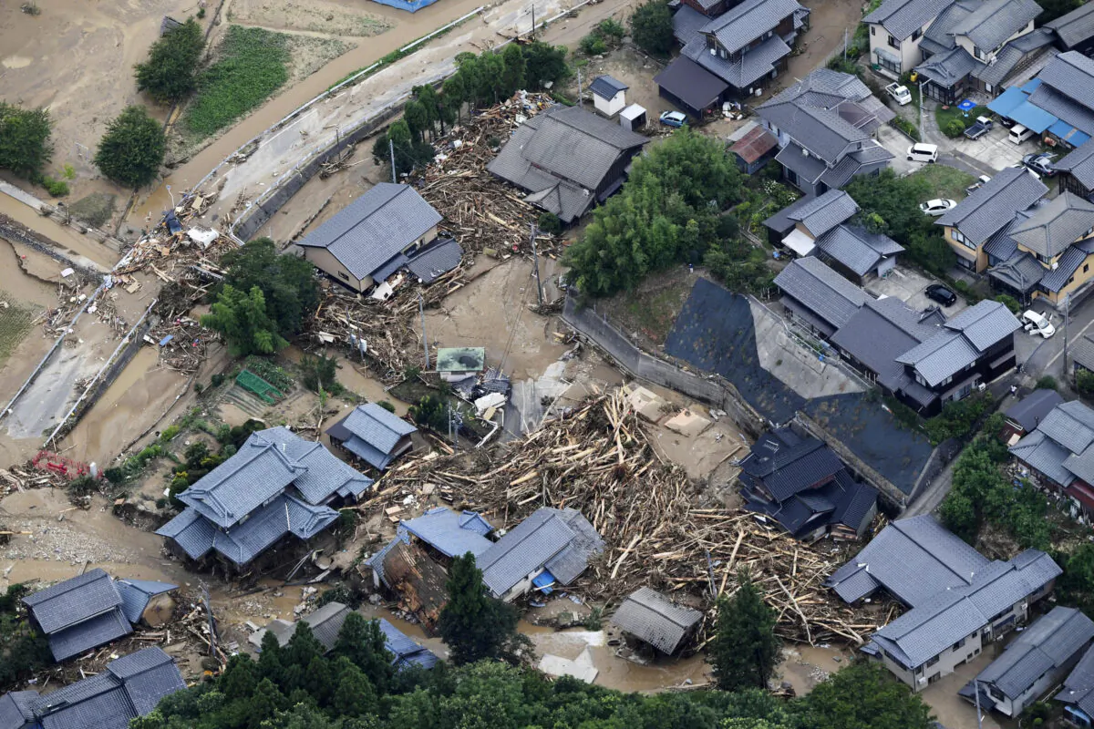 Debris and destroyed houses, caused by a flash flood due to heavy rains, in Murakami, Niigata prefecture, Japan on Aug. 4, 2022. (Kyodo/Reuters)