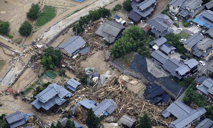 Debris and destroyed houses, caused by a flash flood due to heavy rains, in Murakami, Niigata prefecture, Japan on Aug. 4, 2022. (Kyodo/Reuters)
