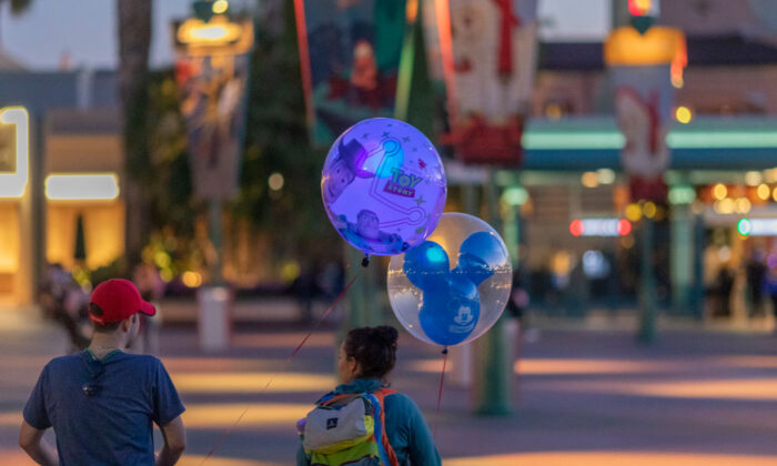 Visitors to Disneyland Park are seen in Anaheim, Calif., on Feb. 25, 2020. (David McNew/Getty Images)
