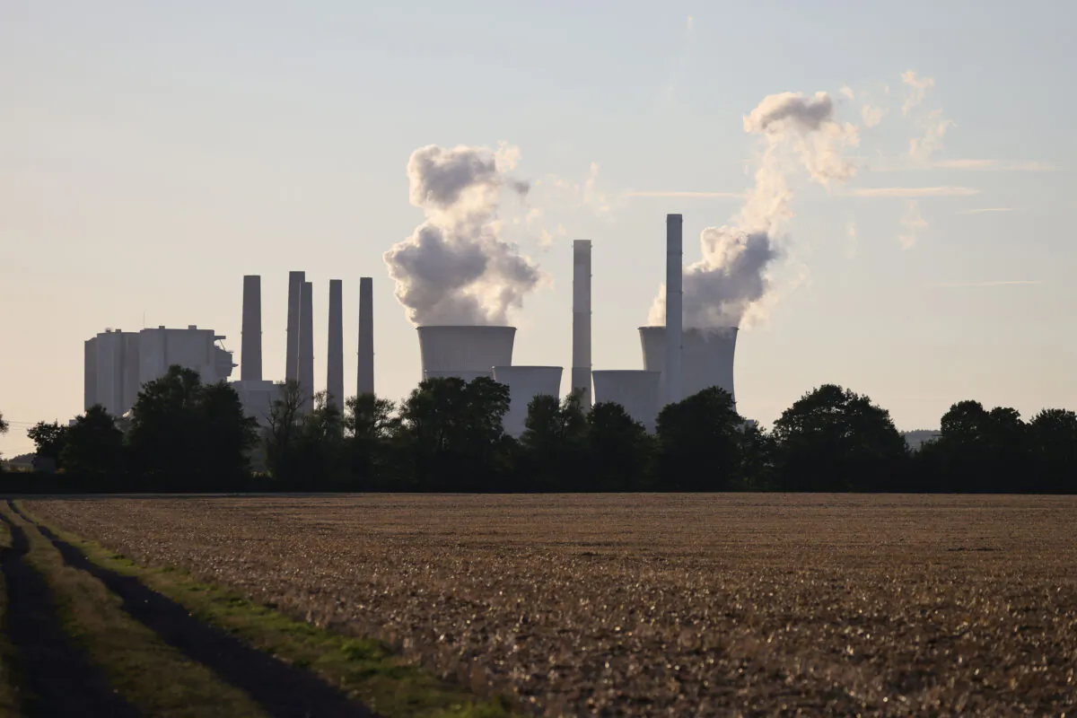 Steam rises from cooling towers of the Neurath coal-fired power plants, near Neurath, Germany, on Aug. 2, 2022. (Andreas Rentz/Getty Images)