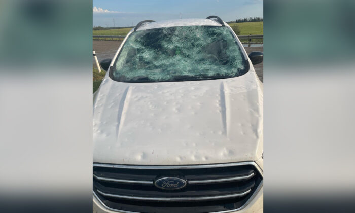 Damage to a car is shown after a hailstorm near Innisfail, Alta. in a Aug.1, 2022, handout photo. (The Canadian Press/Matt Berry/Arktos Graphics)